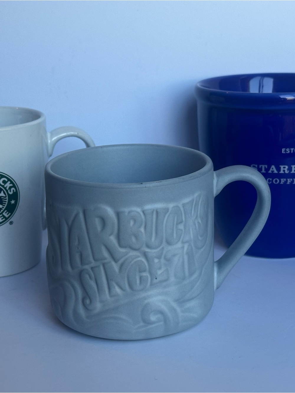 Three Starbucks mugs, ready for coffee!